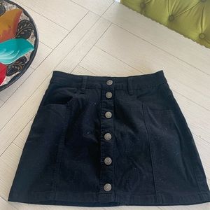 A black button down skirt